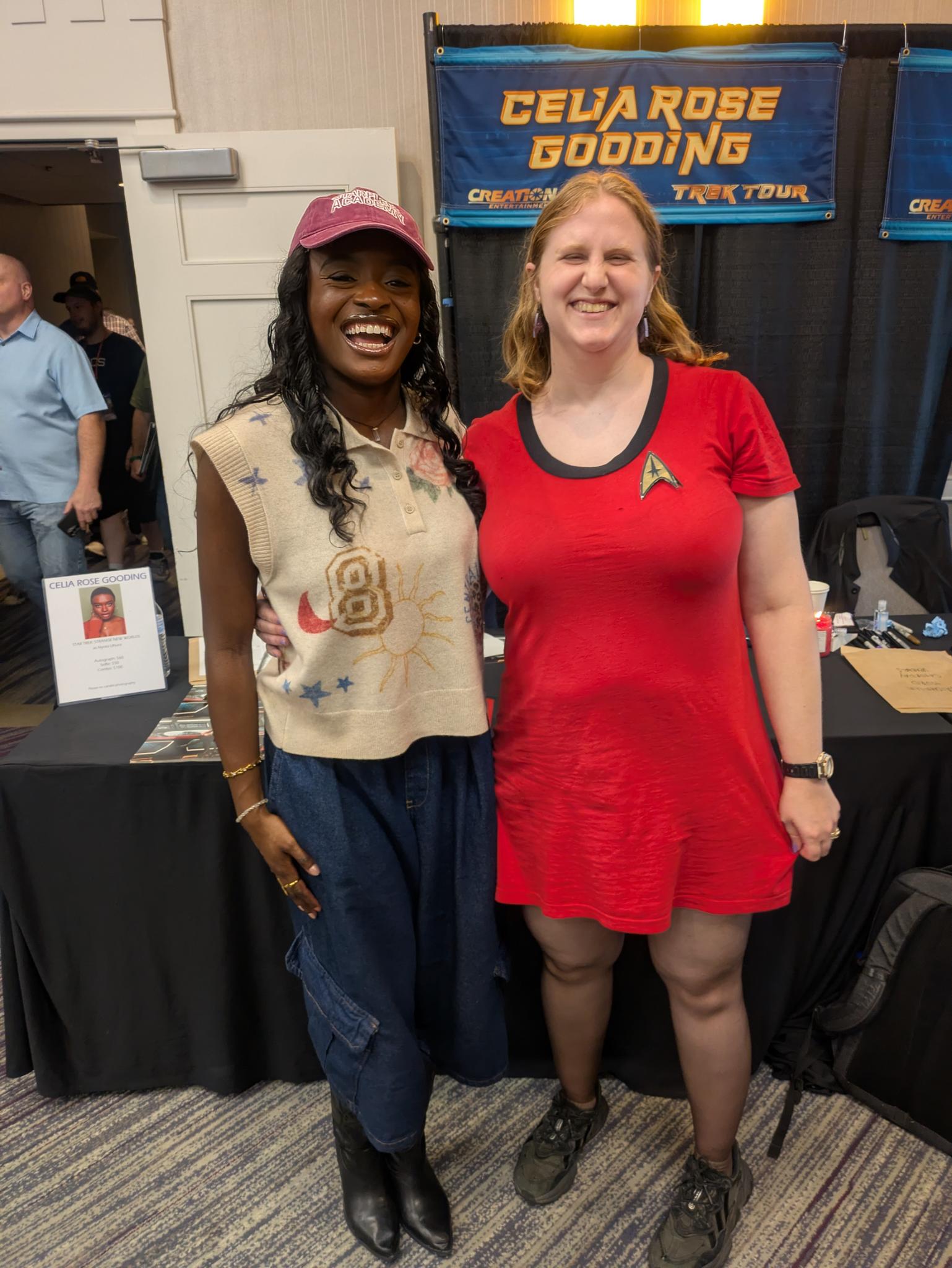 picture description: Celia Rose Gooding, laughing, with a red ball cap and tan vest on, next to me, wearing Uhura's uniform