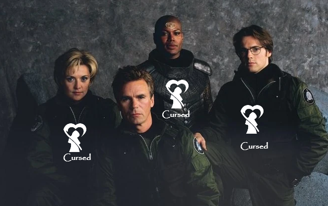 Cast publicity shot for Stargate SG-1 with DFGRR logo and the word "cursed" on 3 out of 4 chests. Characters are, from left to right: Sam Carter (Amanda Tapping) - cursed; Jack O'Neill (Richard Dean Andersen) - not cursed; Teal'c (Christopher Judge) - cursed; Daniel Jackson (Michael Shanks) - cursed