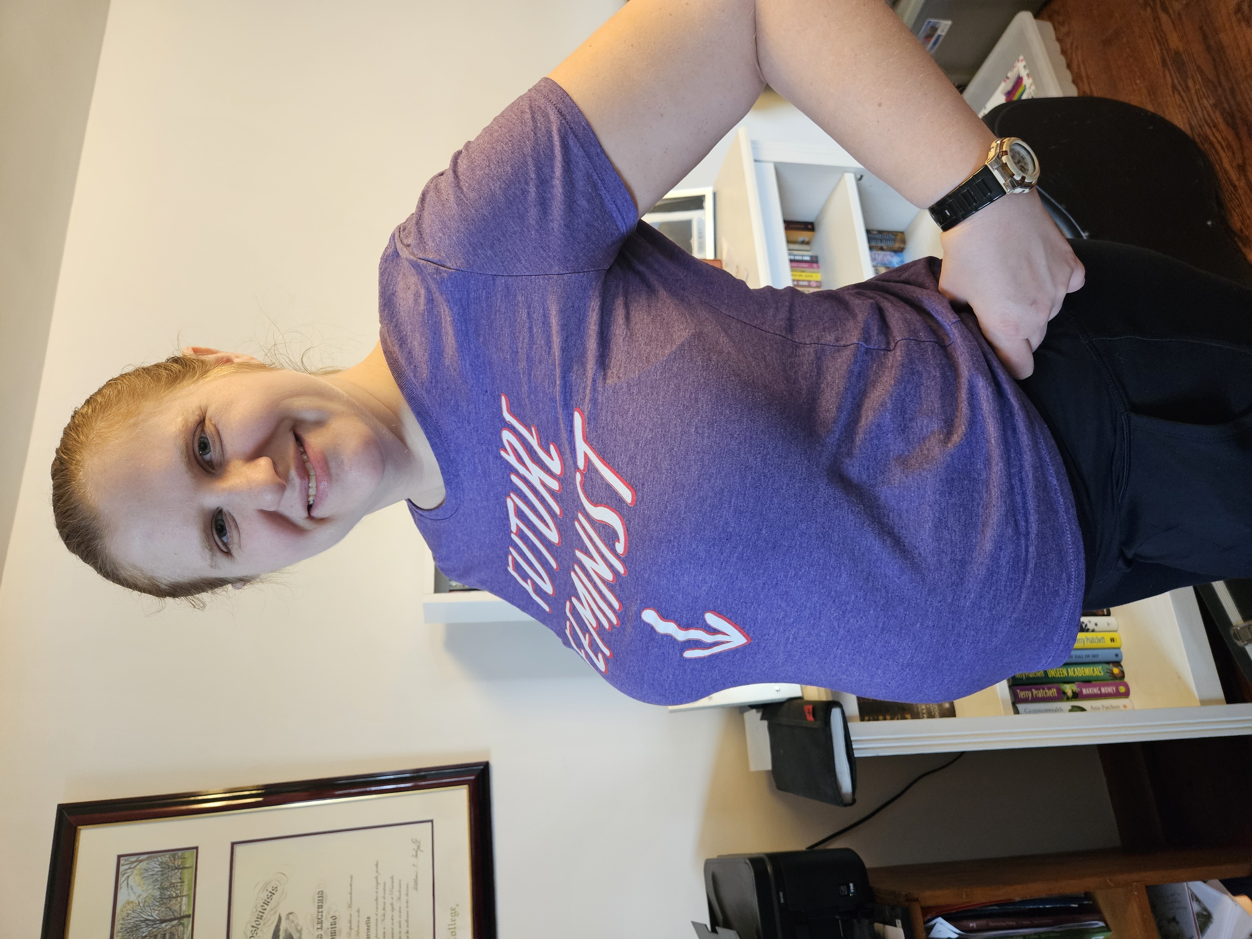 me in a shirt that says "future feminist" with an arrow pointing to my bump