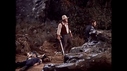 GIF of Little Joe bringing a canteen of water to Adam, Johnson lunging for it, and Hoss throwing him to the ground with one hand